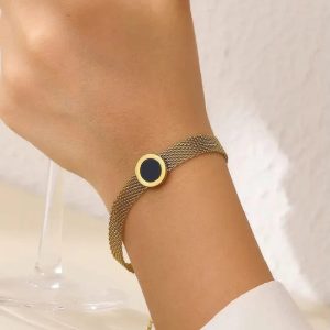 `gold mesh chain bracelet with black medallion charm