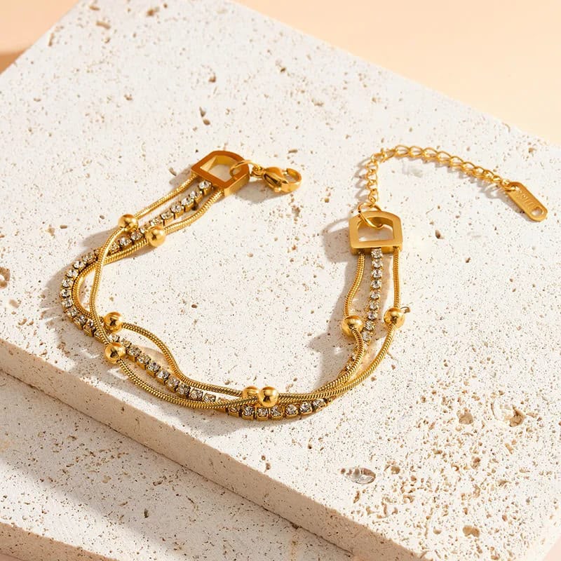 layered gold chain bracelet with crystal strand layered gold chain bracelet with crystal strand