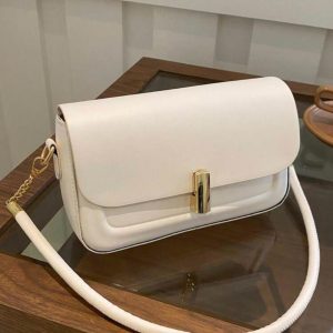 cream shoulder bag with gold buckle